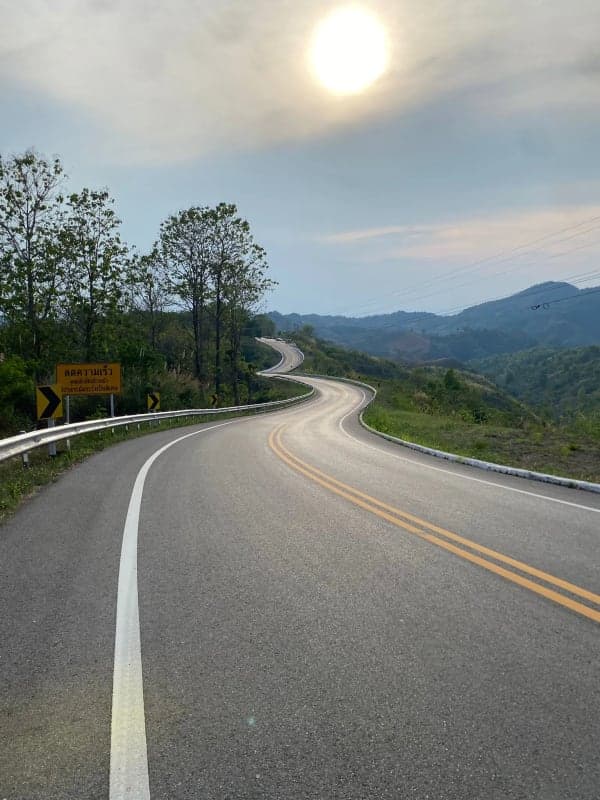 Winding mountain road through Thai highlands