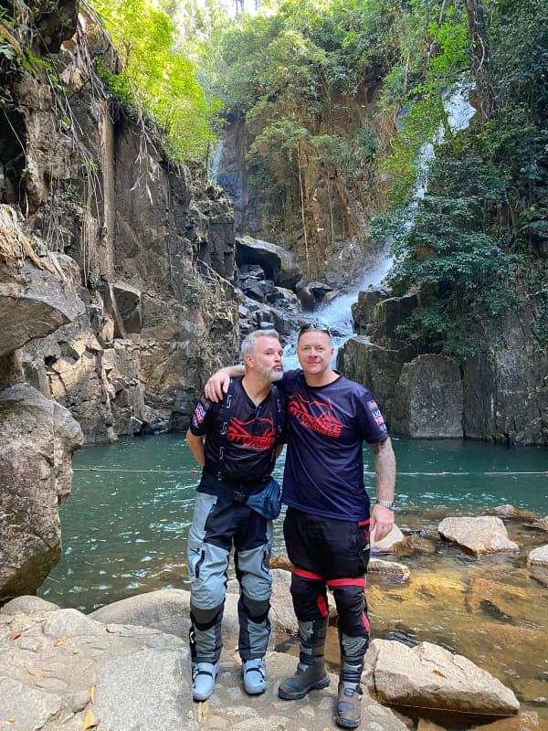 Waterfall stop on a motorcycle tour through the Thai jungle